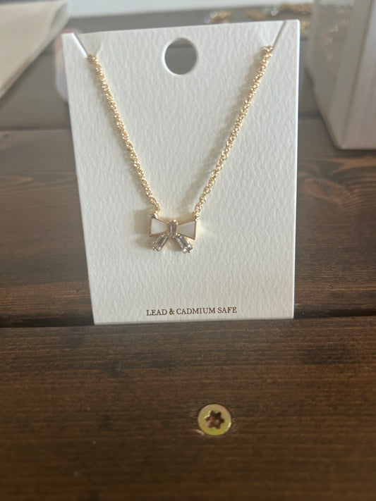 Bow necklace.